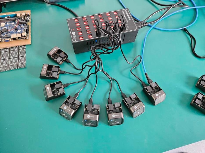A pre-production JetKVM test setup with several units connected at once.